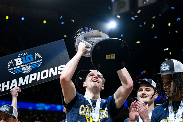 Will Tschetter raises the Big Ten Tournament trophy