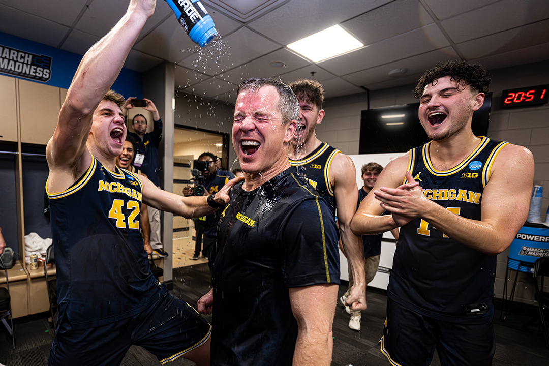 Men's basketball team pours water on head coach Dusty May