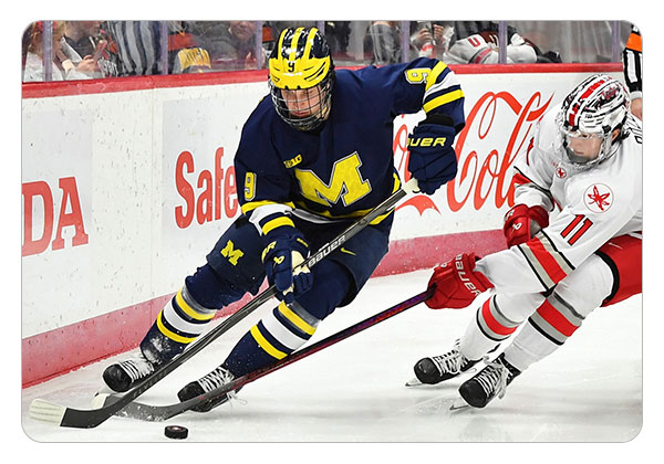 Moldenhauer carrying the puck against Ohio State