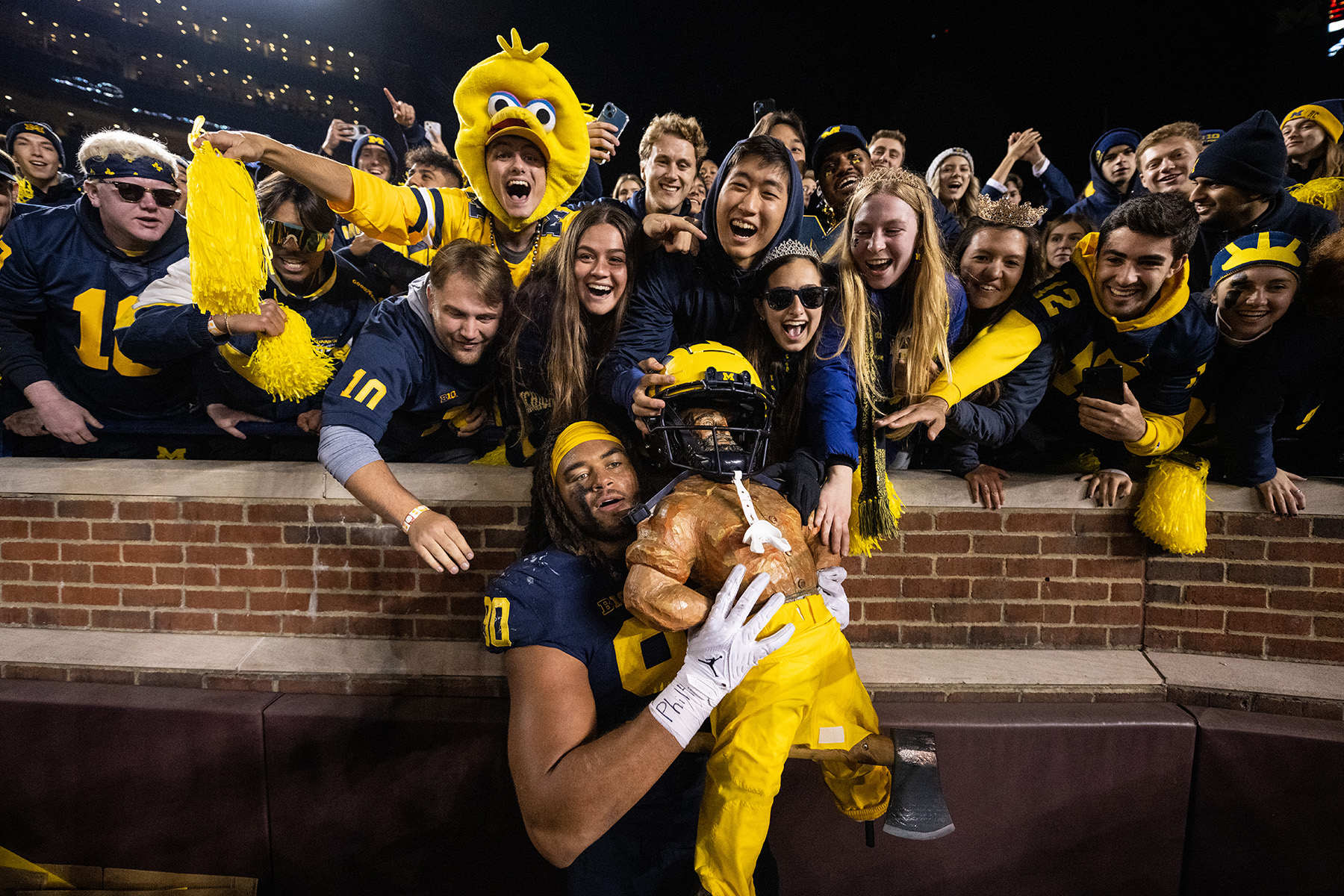Michigan Student Section with the Paul Bunyan Trophy vs. Michigan State